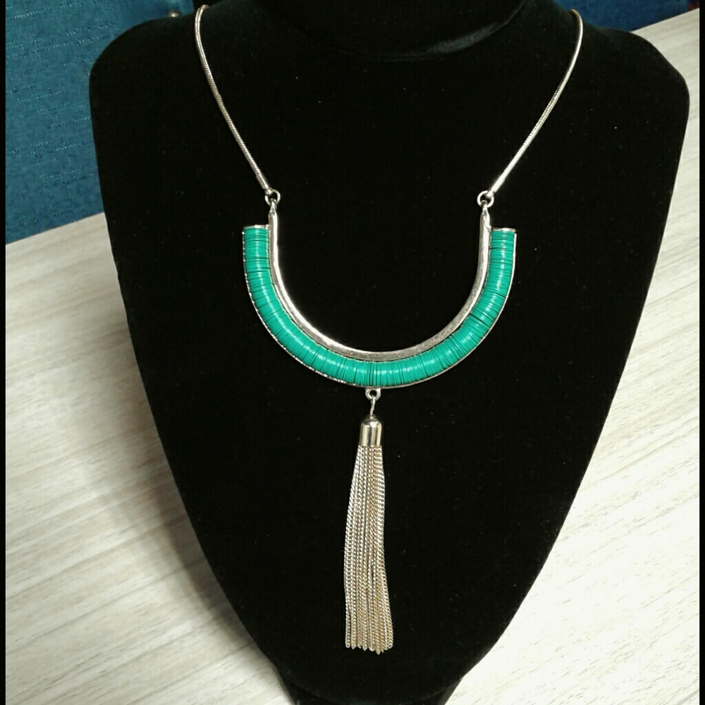 gold tone necklace with tassel and bead